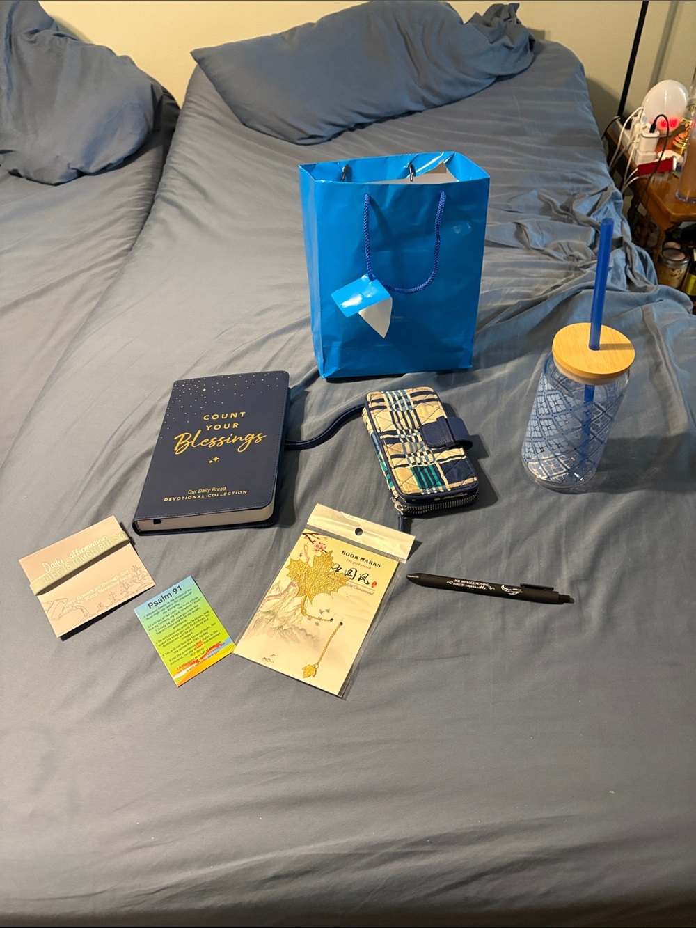 Inspirational bundle with devotional book mark, pen, bracelet, cup and wristlet.